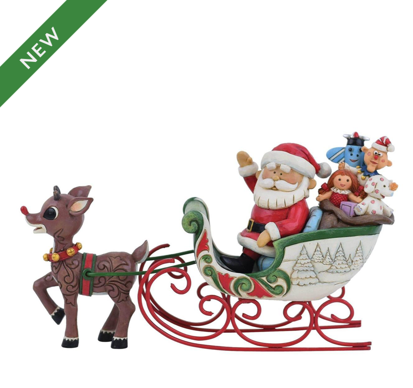 Rudolph Pulling Santa in Sled