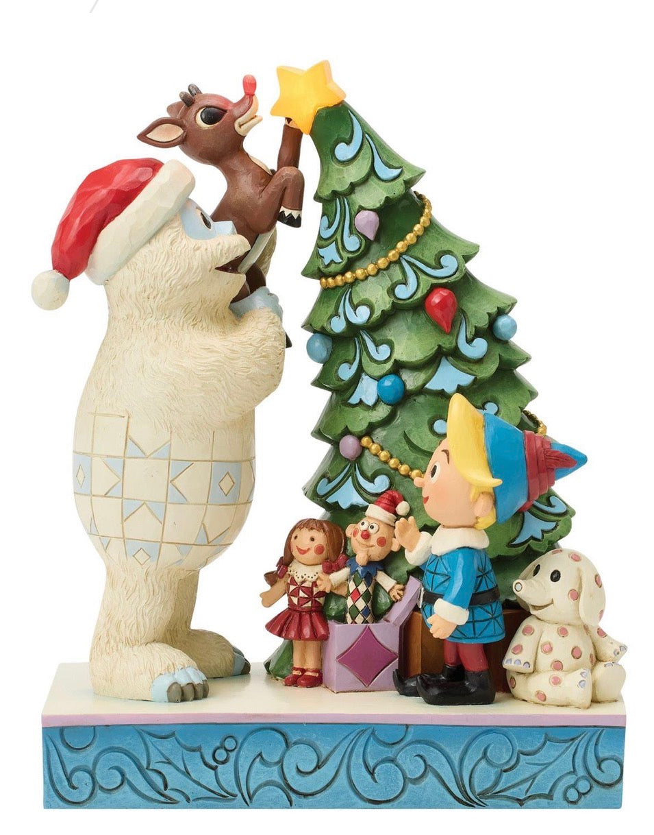 Bumble Holding Rudolph by Tree