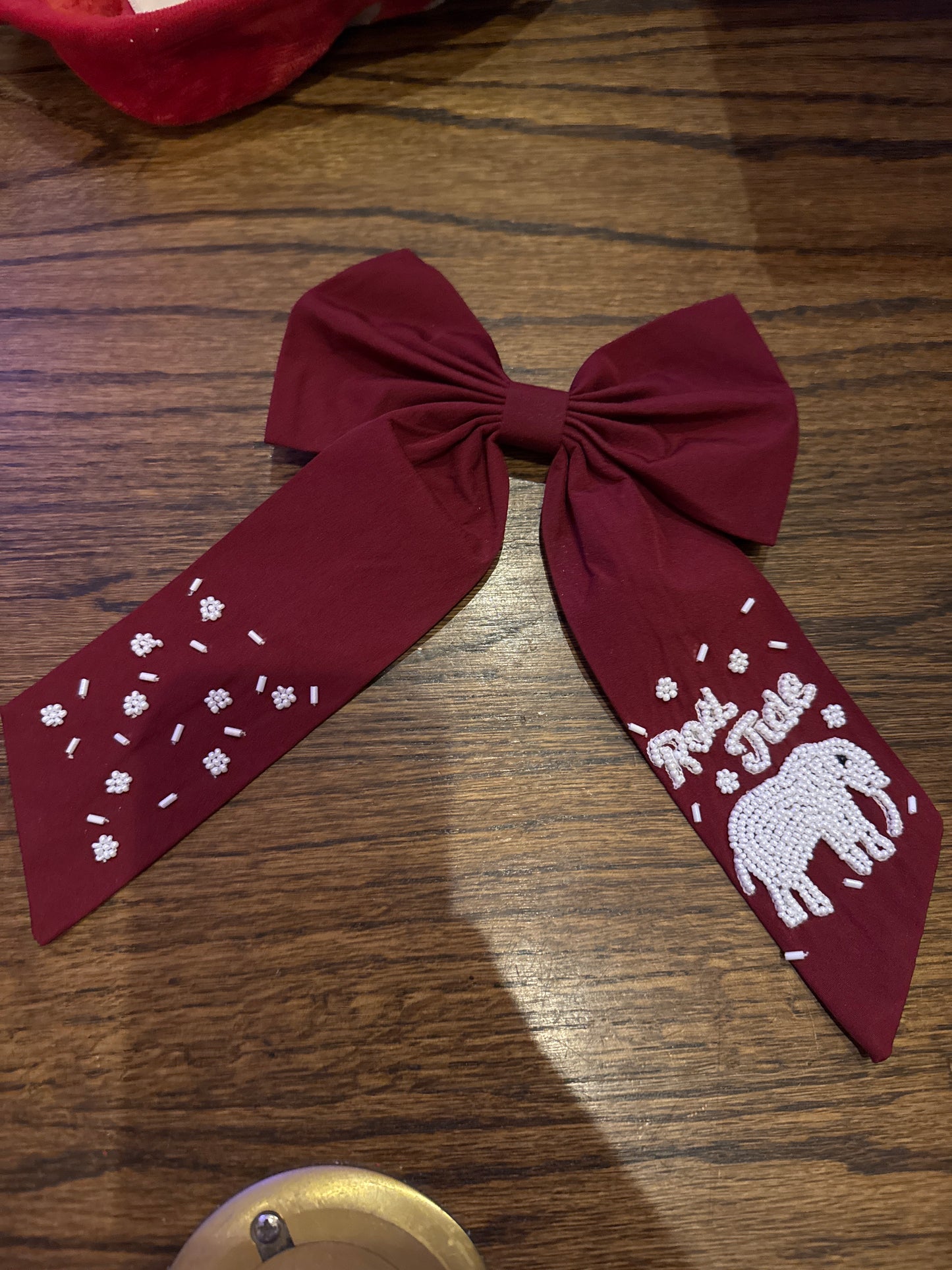 Red Roll Tide bow white writing